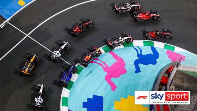 Formel 1 Race cars in a pack taking a corner